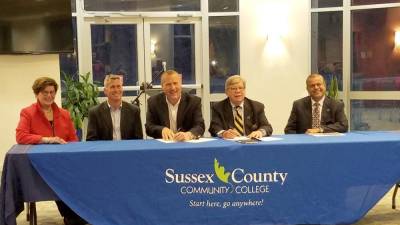Representatives from Sussex County Community College (SCCC) and the McGuire property sign documents to purchase the McGuire location. Left to right: Judge Lorraine Parker, former Board Chair; Sean McGuire; Michael McGuire; William Curcio, SCCC Board Chair and Ketan Gandhi, SCCC Chief Financial Officer.