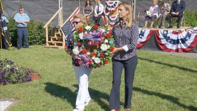 Mayor Patricia Zdichocki (left) and U.S. Rep. Mikie Sherrill carry the 9/11 wreath (Photo by Vera Olinski)