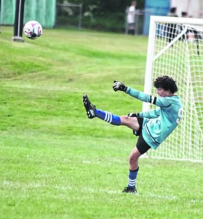 Sussex Tech goalie Ben Gomes punts the ball.