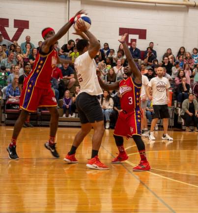 HW1 The Harlem Wizards show off their moves during the sold-out fundraising game Thursday, Oct. 12 at Newton High School. (Photo by Nancy Madacsi)