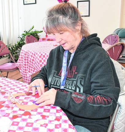 Doris Szilasie of Newton works on a craft.