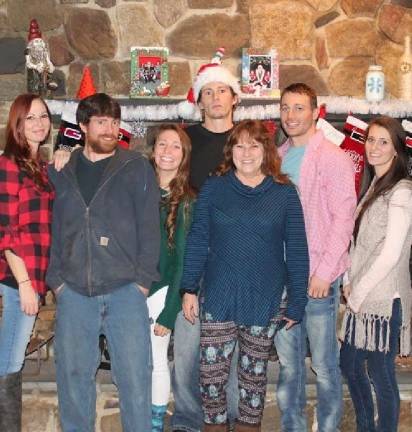 DeFabritis, fifth from the left, with her six children at Christmas 2016.