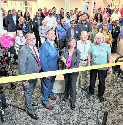 The ribbon is cut on renovations at Bristol Glen.