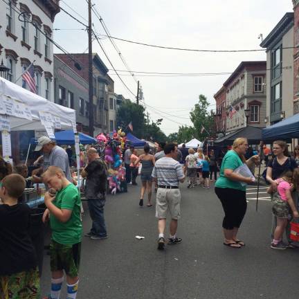 The street filled with festival goers.