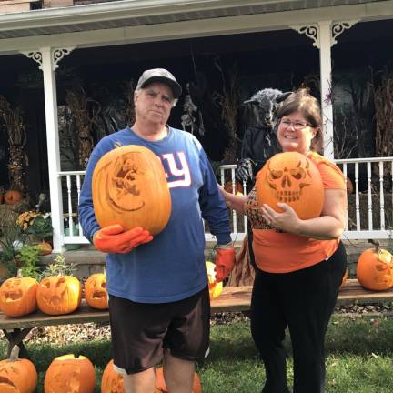 PK1 Mike Young and Sara Bartlett decorate their Stillwater home with carved pumpkins every year. (Photo by Laurie Gordon)