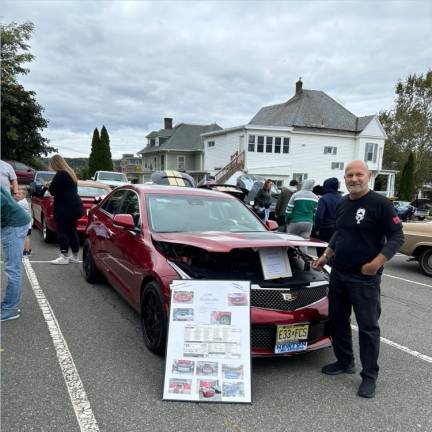 Gary Posey with his car, a 2018 Cadillac ATS.