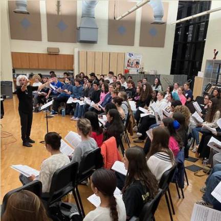 <b>Dr. Deborah Gianuzzi rehearses with the All-Sussex County Band at Sparta High School on Oct. 29.</b>