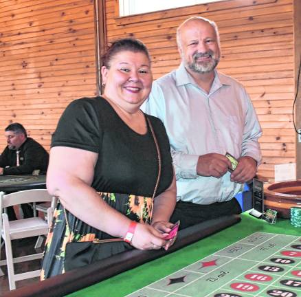<b>Shannon Berganza of Wantage and Anthony Ventre of Sparta, owners of Brothers Pizza, pose for a photo.</b>