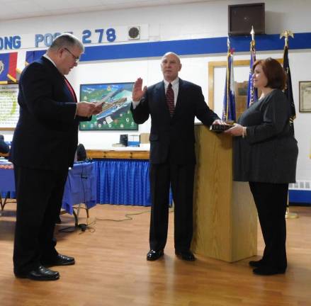 (L-R): Senator Steve Oroho (R-24) reads the oath of office for longtime friend Raymond Cipollini as he is sworn in as a councilman in Stanhope. Holding the bible is Cipollini’s wife Laurie. Stanhope held its annual reorganization meeting at American Legion Post 278 on Tuesday, Jan 7, 2020.