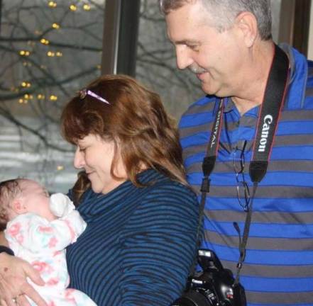 DeFabritis and Talmadge welcome Terrie's seventh grandchild into the world.