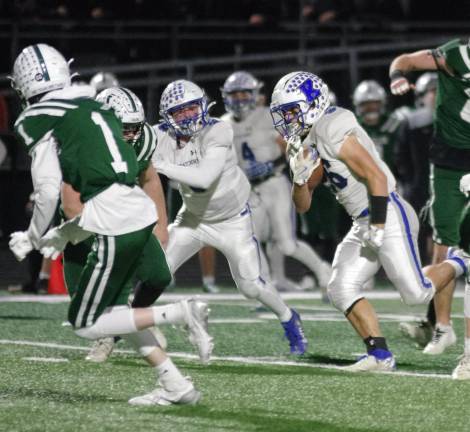 Kittatinny ball carrier Lucas Inglima runs through an opening in the Kinnelon defense.