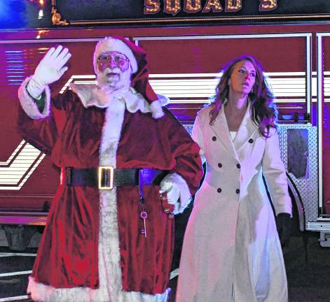 Santa Claus arrives at the tree lighting.