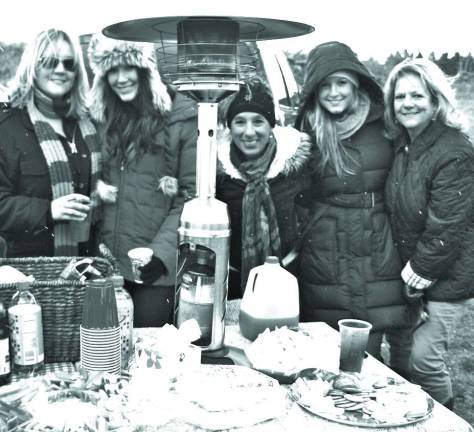 From left Jenn Mann of Freehold, Britt Desch of Colts Neck, Ann Romano of Sparta, Meag Desch of Colts Neck and Lynn Desch of Colts Neck attend the Tailgate Party on the grounds of Saint Paul's Abbey in Newton.