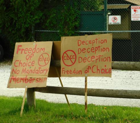 Protest signs rest on the fence in front of the Cranberry Lake's clubhouse property on Thursday, April 25, 2019.&#xa0;(Photos by Mandy Coriston)