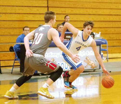 Kittatinny's Justin Dube dribbles the ball while High Point's Brendan Franko tries to keep pace in the first quarter. Dube scored 11 points.