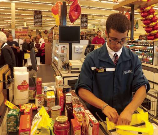 Eric Kay in action in the Best Bagger contest at the Byram ShopRite on Tuesday, Oct. 8. Kay went on to take first prize.
