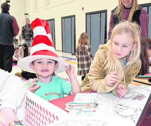 Benny and Allie Loverdi work on a craft.