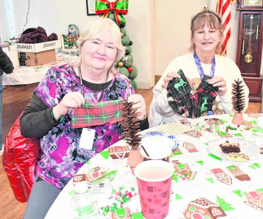 Doreen Pasqueletto and Doris Szilasie, both from Liberty Towers, work on their crafts.
