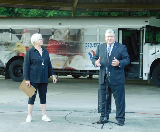 State Senator Steve Oroho (R-24) offers congratulations to Project Help Executive Director Sandy Mitchell (L) on the unveiling of the organization's mobile closet for veterans, at a ceremony held Tuesday, Sep 10, 2019 at Sussex County Community College in Newton.