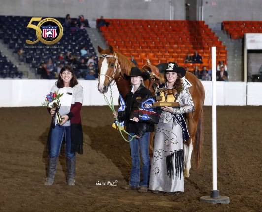 Brooke, center, winning an award