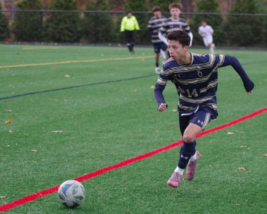 Pope John's Ethan Nowak pursues the ball.