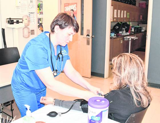 Corey Finelli of Blairstown checks blood pressure.