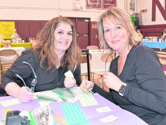 Nicole Constanza and Kim Jankowski, both of Byram, look up from their bingo cards.