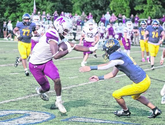 Newton wide receiver Juzziah Sheppard handles the ball after a catch in the first half.