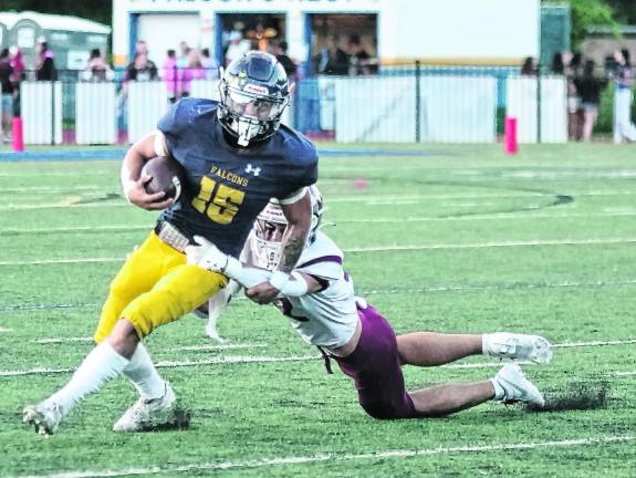Jefferson ball carrier Braedan Cummings is tackled by Newton defender Braxton Guerra in the first half.