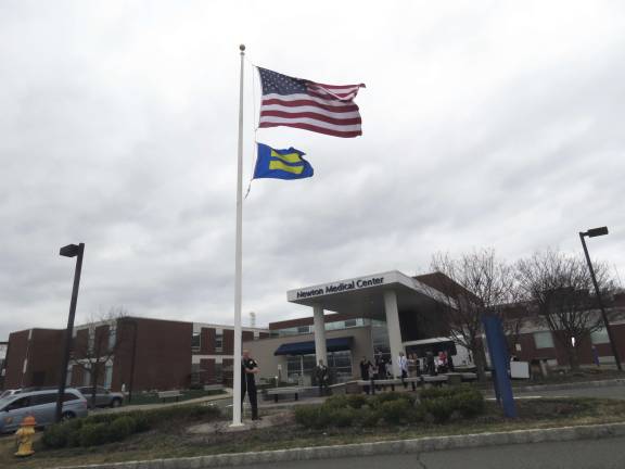 Newton Medical Center's recognition as a Leader in LGBT Health Care Equality was marked on March 31 with a ceremony raising the equality flag (visible below the U.S. flag) outside the hospital.