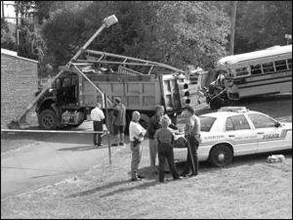 Dump truck collides with school bus