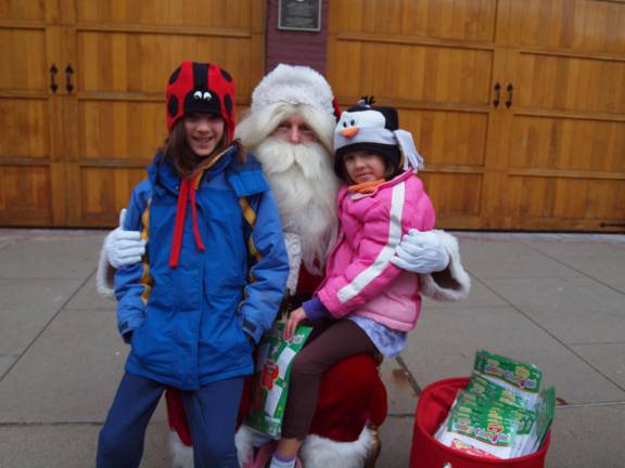 Kristine Zurovchak (9) and Kathryn Zurovchak (6) of Newton, with Santa.