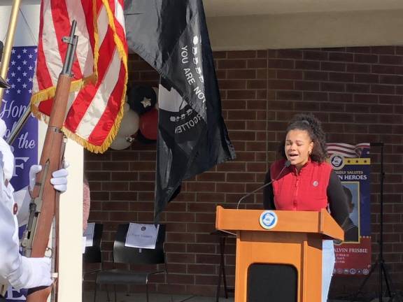 Jazira Faines, a student at Newton High School, sings the National Anthem.