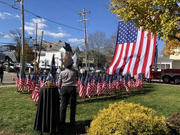 NV1 Taps is played during the Flags of Honor Dedication Ceremony on Saturday, Nov. 11 in front of Newton Town Hall. (Photo by Kathy Shwiff)