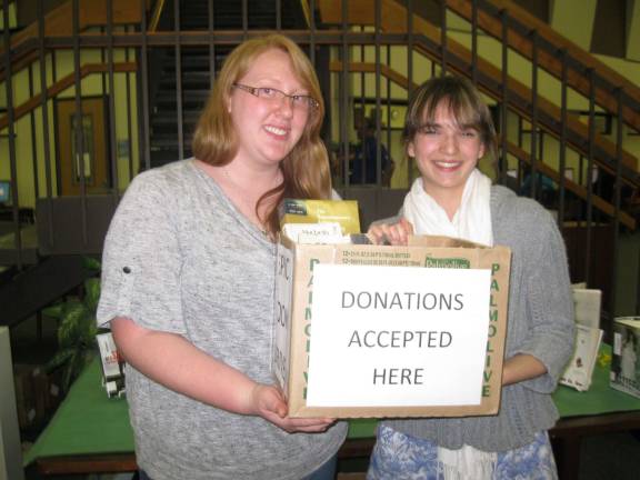 Photo by Heather Ann Schaefer Kittatinny seniors Jackie Cali (left) and Katie Schoen (right) are sponsoring a book drive to benefit children who are not fortunate enough to have books of their own.