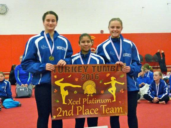 Second place platinum team at the Turkey Tumble, from left: Morgyn Witt (Newton), Emily Rodriguez (Stillwater) and Audry Biss (Sparta).