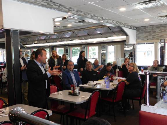 Rep. Josh Gottheimer (D NJ5, at L) speaks with Andover Township resident Dimitri (in red) about funding for the diagnosis and long-term treatment of Lyme Disease, at the Rt. 206 Diner in Andover Borough on Tuesday, Oct 8, 2019.