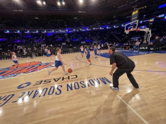 Benjamin Davey coaches his young players at Madison Square Garden in New York City. (Photos provided)