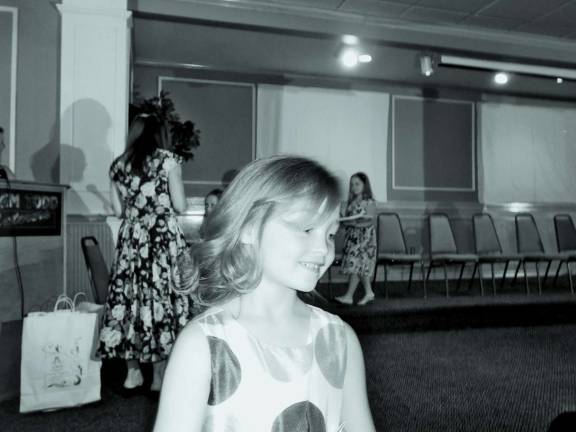 Cameron Ecke after receiving her gift for participating in Byram's Little Princess competition.