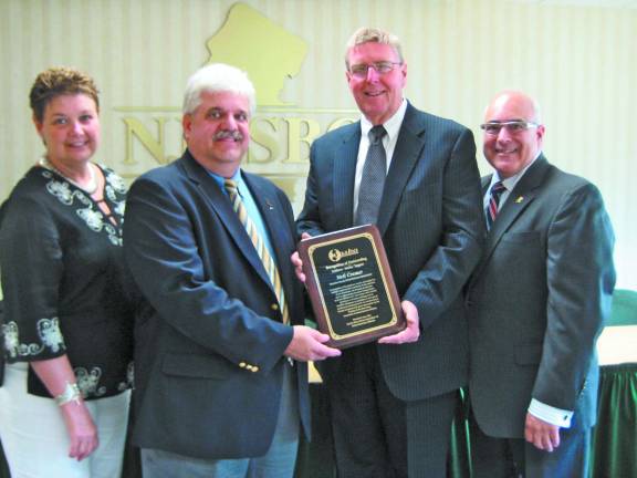 Sussex County Executive School Business Administrator, Neil K. Cramer, was recognized with an award for Outstanding Guidance, Service and Support at a recent NJASBO trustees meeting. Pictured from left: Theresa Sierchio, business administrator, Hopatcong Borough Schools; Cramer; John F. Donahue, executive director, NJASBO; and Anthony Dragona, RSBA, immediate past president, NJASBO.