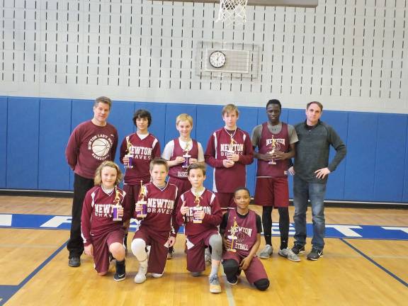 The seventh grade Newton Braves with their coaches and the championship trophies they earned. At far left head coach Scott Buckley and at far right is assistant coach James Felix. Players, from left, Jake Faye, Jake Felix, Michael Atta, Darrell Mims, Robert Giordano, Ryan Aroyso, Merrick Buckley and Dylan Duffy. Photos by George Leroy Hunter