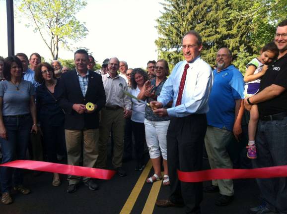 Ray Bonkewr cuts the ceremonial ribbon