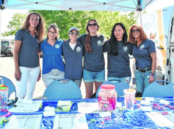 Kim Williams, Helen and Claire Humbert, Alyssa Armstrong, Meghan Griffin and Carrie Lamber of Newton Animal Control pose for a photo.