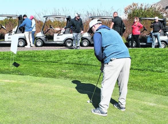 <b>Michael Ganguzza of Sparta golfs</b>