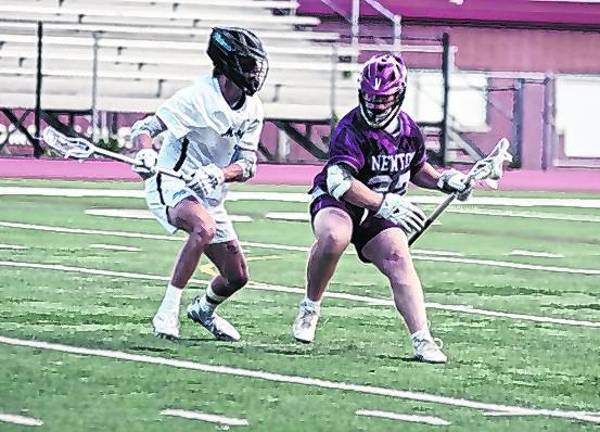 Newton's Damien Thoresen tries to outmaneuver a Mahwah defender.
