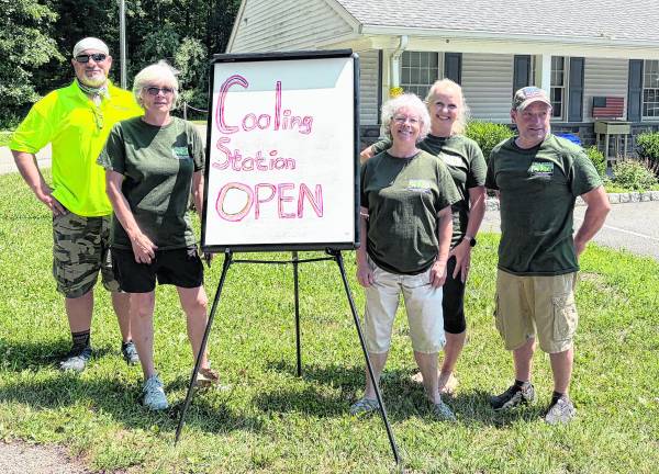 Members of Stillwater CERT stand outside a cooling station.