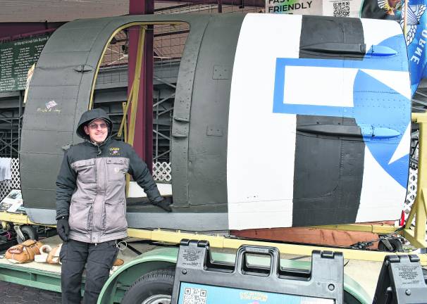 <b>Matt Susko stands in front of a S-47 Skytrain D-Display.</b>