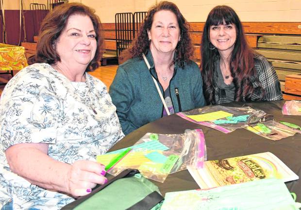 Carol Teratino of Flanders, Patti Bolduc of Andover and Tina Bautz of Roxbury sit at a table.