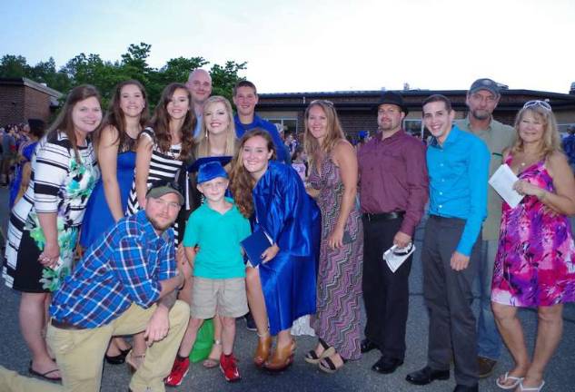 Graduate Cheyenne Rachel Gullette (center in blue) and her family. Some family members came as far away as Kentucky to witness Cheyenne's big day.