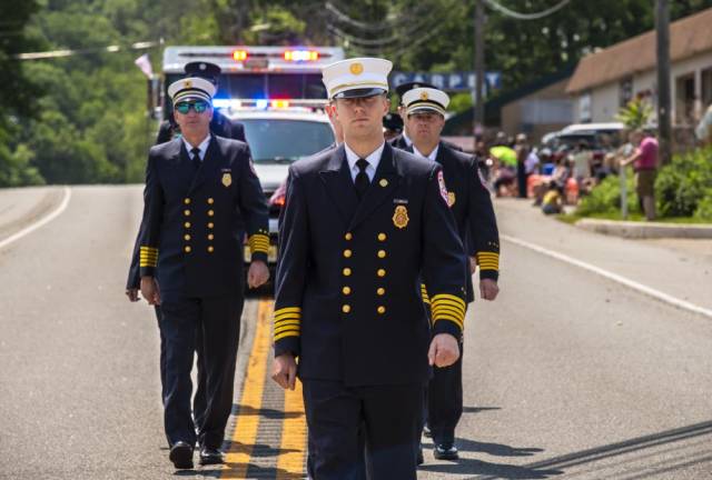 Members of the Andover Township Fire Department march in the Byram parade.